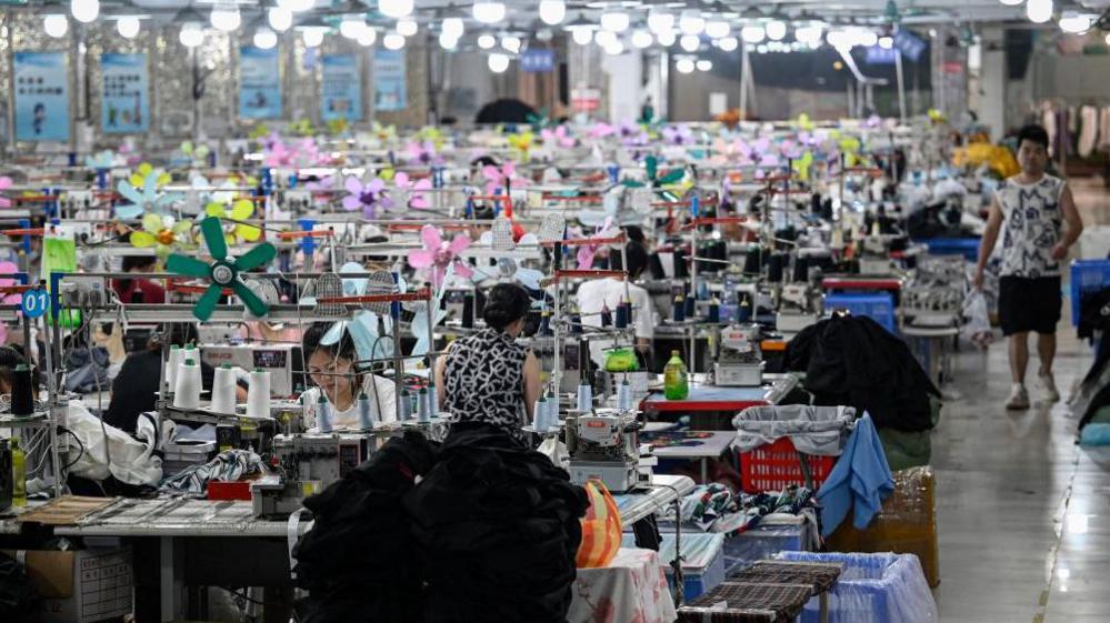 Workers producing garments at a Guangzhou textile factory that supplies clothes to Shein.
