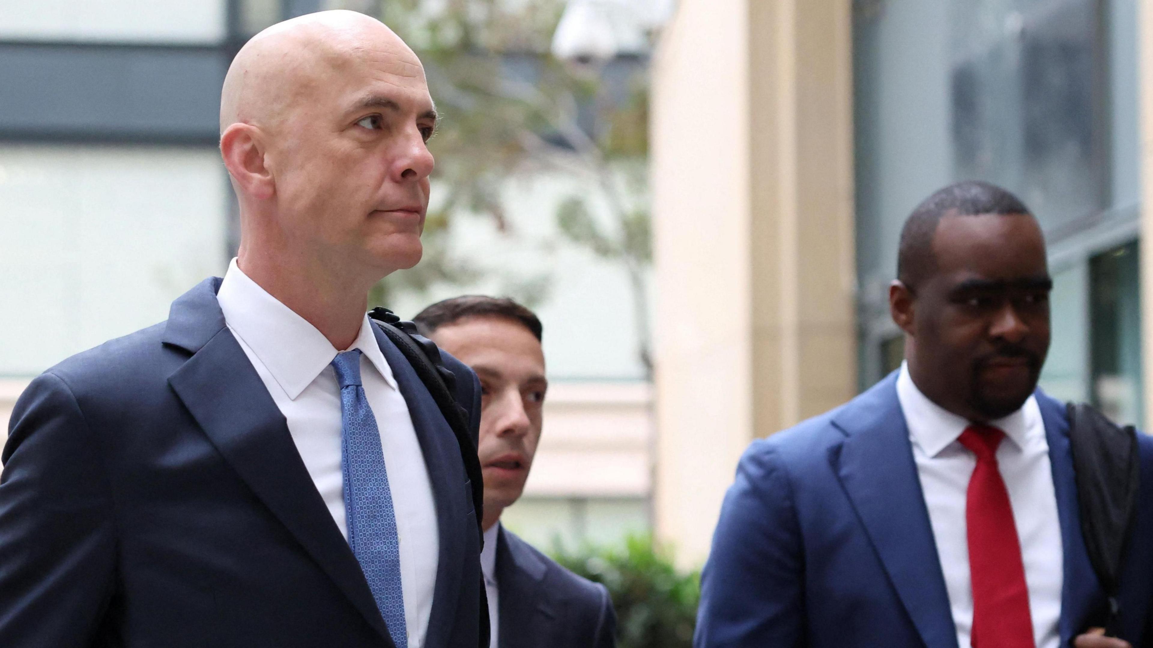 Paul Schmidt, a lead attorney for Meta, heads into an Oakland, California courthouse for the first day of trial in a major lawsuit against the company brought by several state attorneys.