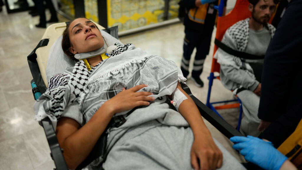 An activist from the Global Sumud Flotilla is carried on a wheel stretcher upon her arrival at Istanbul Airport, in Istanbul, Turkey.