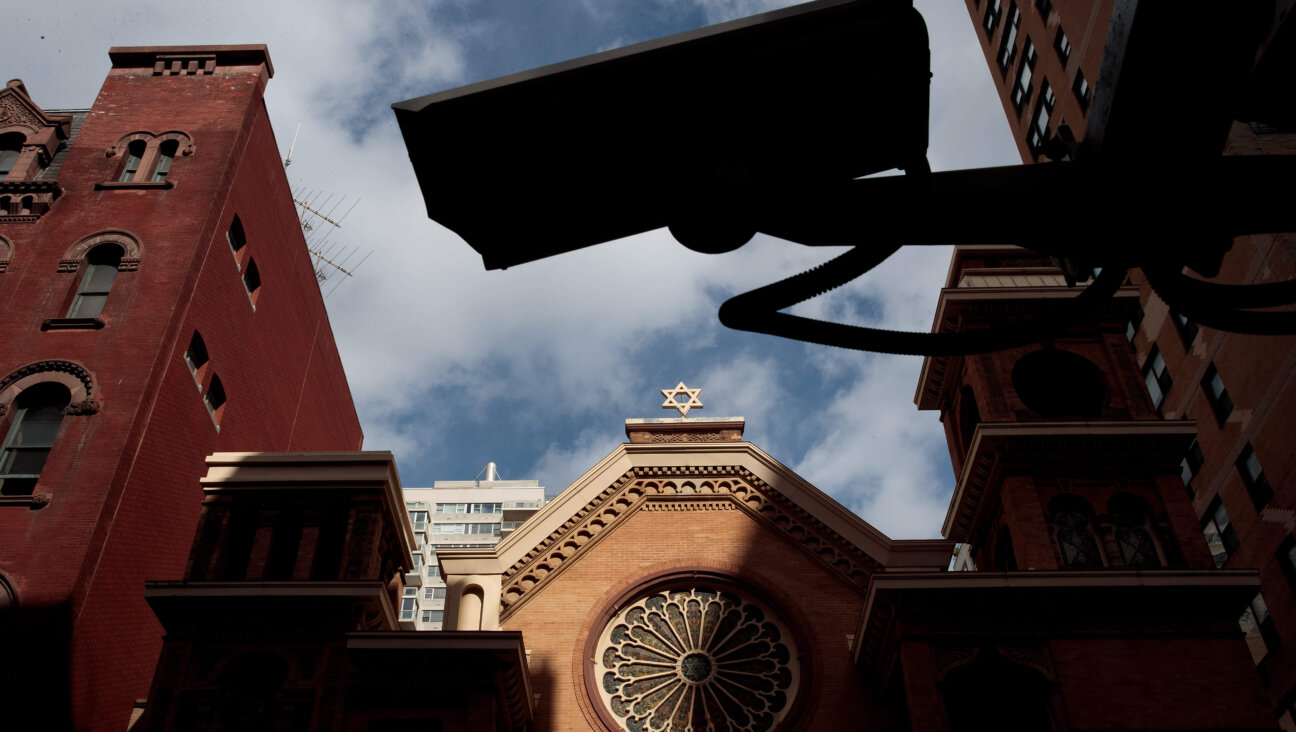 A Security camera hangs across the street from the Park East Synagogue, March 3, 2017 in New York City. 