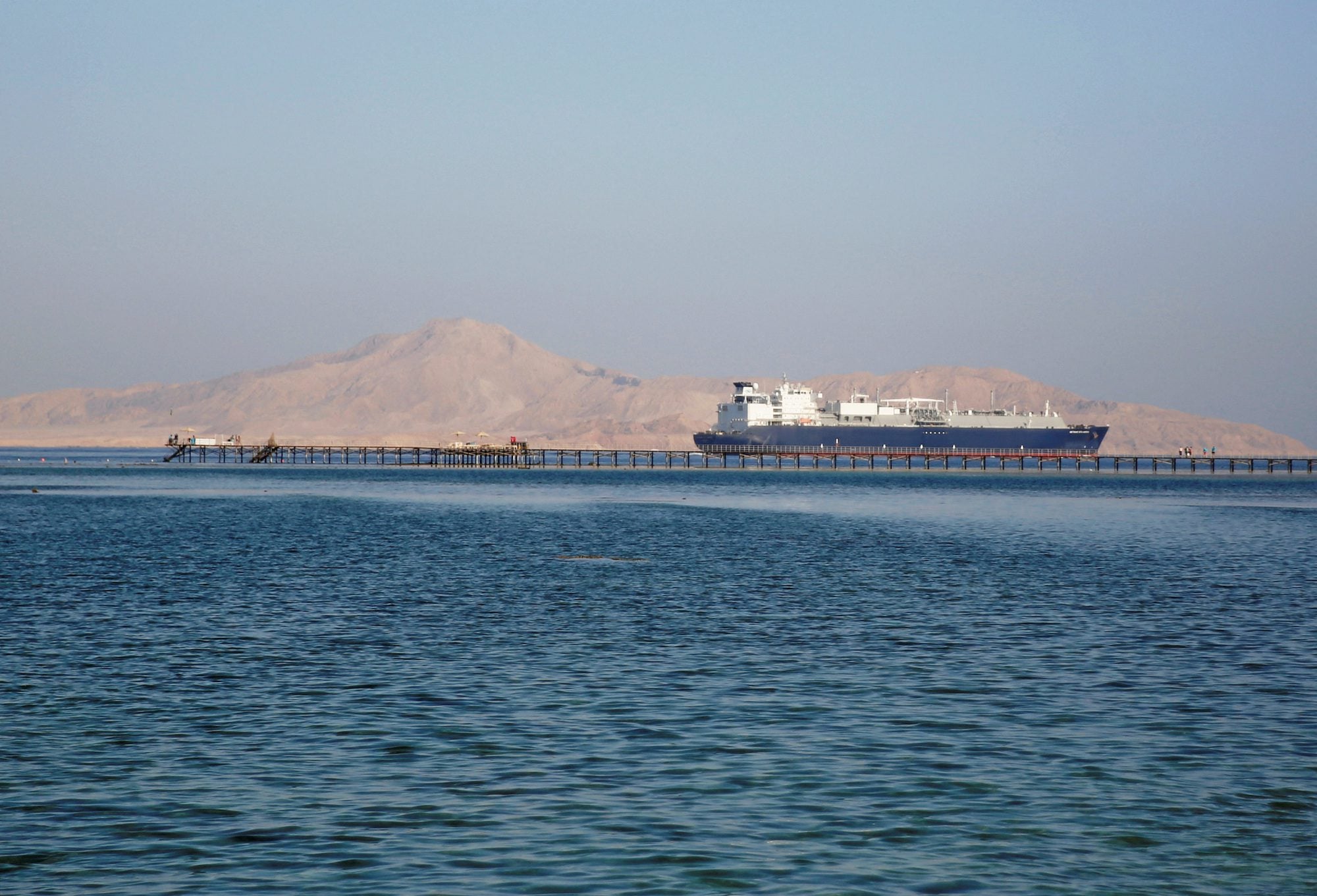 A ship passes by a beach in the Aqaba Gulf in front of Tiran island which transferred into Saudi Arabia in 2017 off the Red Sea resort of Sharm el-Sheikh, Egypt July 12, 2018. Picture taken July 12, 2018. REUTERS/Amr Abdallah Dalsh