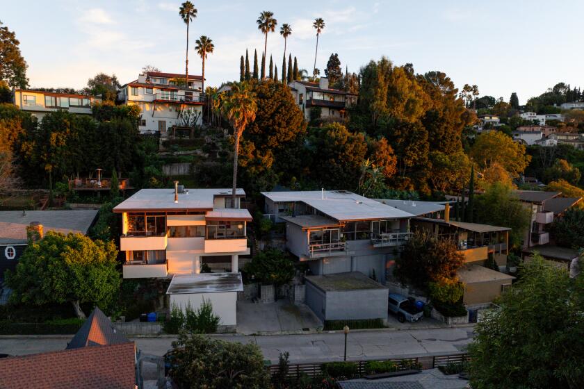 Silver Lake, CA - January 13, 2026: The sun sets on homes along Fernwood Avenue on Tuesday, Jan. 13, 2026 in Silver Lake, CA. (Kayla Bartkowski / Los Angeles Times)