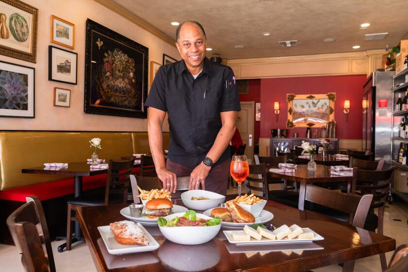 PASADENA, CA -- FEBRUARY 13, 2026: Onil Chibas owner of Deluxe 1717 in Pasadena, California on Friday, February 13, 2026. (Da'shaunae Marisa / For The Times)