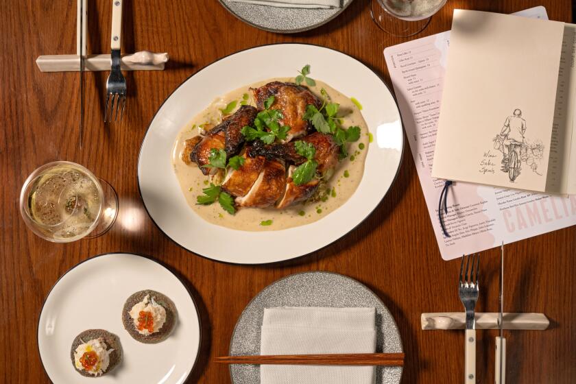 LOS ANGELES, CA - OCTOBER 25, 2024: Koji-Roasted Green Circle Chicken and Dungeness Crab on Purple Blini at Camelia in The Arts District of downtown Los Angeles (Ron De Angelis / For The Times)