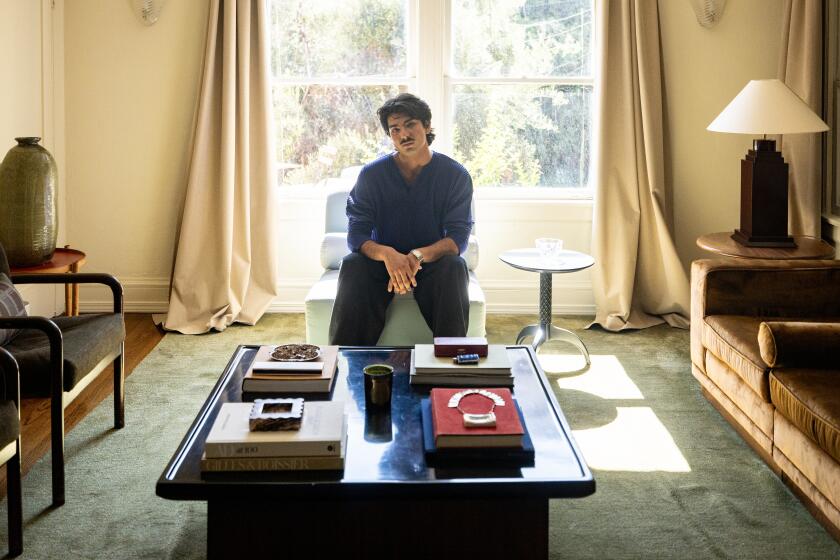 LOS ANGELES, CA-JUNE 19, 2026: Julio Miranda-Martin's poses in the living room of his Hollywood apartment in Los Angeles, on Friday, June 19, 2026.