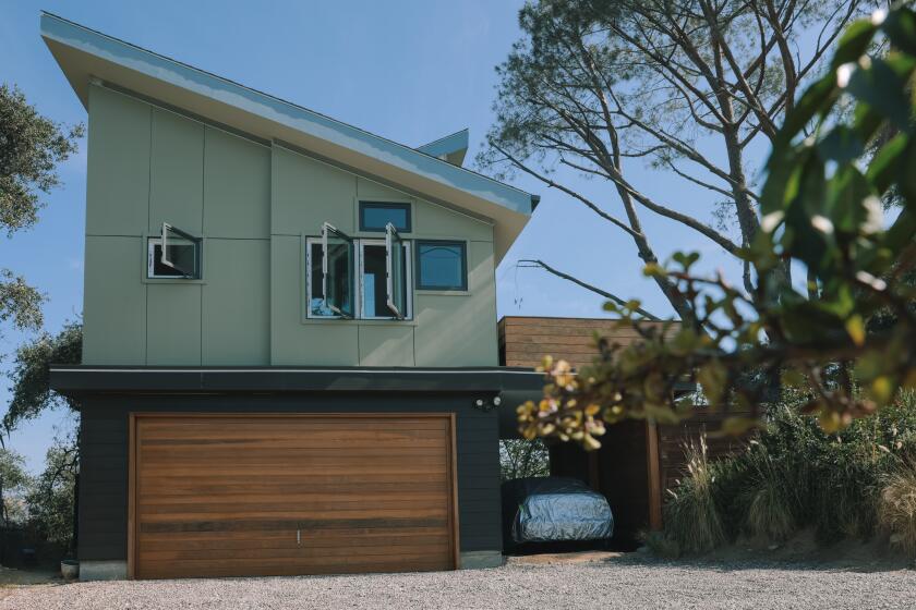Los Angeles, CA - July 24: Joshua Leibner and Katherine Henninger transformed the only buildable space on their steep Eagle Rock property into a 400-square-foot ADU perched above their garage and is seen here on Friday, July 24, 2026, in Los Angeles, Calif. Though construction ultimately cost nearly $500,000, far beyond their expectations, the couple sees the architecturally ambitious space as both a work of art and a future source of rental income. (Dania Maxwell/ For The Times)