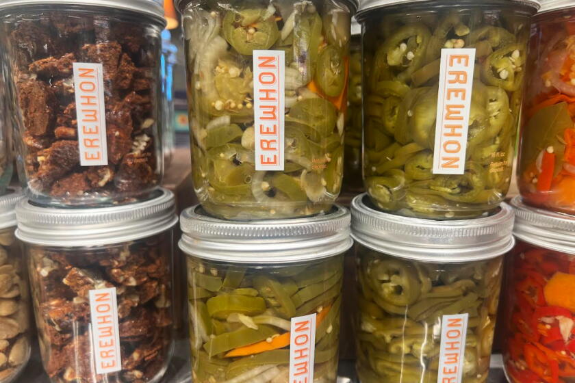 Some of the products at the Erewhon market in Manhattan Beach, include jalapenos in a mason jar. Shelby Grad/Los Angeles Times