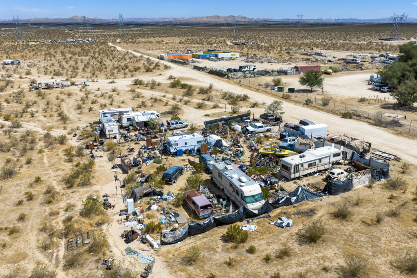 Pearblossom, CA - Aug. 18, 2026: An aerial view of some of the hundreds of homeless RVs and encampments without addresses scattered across miles of Pearblossom and Sun Valley in unincorporated Los Angeles County Tuesday, August 18, 2026. More than 200 unpermitted parcels exist in the Pearblossom area. Many cannot qualify for permits without utilities, yet power, water, sewer and trash service can be prohibitively expensive-or simply impossible-to bring to remote properties. In much of L.A. County, living off-grid is illegal unless a property was grandfathered in decades ago. Even legally purchased land can remain without an address because of the cost and difficulty of connecting to basic infrastructure. Questions remain about whether roughly 700 RVs were removed from unincorporated Antelope Valley, as reported in the 2026 homeless count. Residents say the number of RVs may have actually increased in the greater Pearblossom area. (Allen J. Schaben / Los Angeles Times)