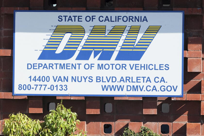 FILE — In this April 9, 2019 file photo is the California Department of Motor Vehicles office in the Arleta neighborhood of Los Angeles. The California DMV announced Tuesday, Jan. 28, 2020, that it has come to an agreement with soccer fan Jonathan Kotler who had sued the department claiming it had violated his First Amendment rights by rejecting a personalized license plate he said would celebrate his favorite team, but which the DMV said might be deemed offensive. The lawsuit said Kotler applied for a plate that would read COYW, an abbreviation of "Come on You Whites," a slogan used by fans of London-based Fulham Football Club, referring to their signature white shirts. A DMV spokesperson said it is expediting the approval to get it the plate to Kotler as soon as possible. (AP Photo/Richard Vogel, File)