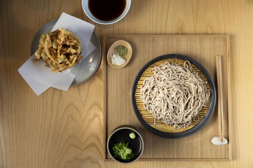 LOS ANGELES, CA - OCTOBER 01: A plate of zaru soba noodles with yuzu and matcha salt and traditional tsuyu dipping sauce with kakiage - shrimp and mixed vegetable fritter at Sobar in Los Angeles, CA on Tuesday, Oct. 1, 2024. (Myung J. Chun / Los Angeles Times)
