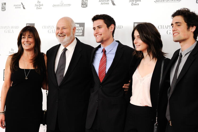 the reiner family poses for photos