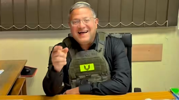 Israeli National Security Minister Itamar Ben-Gvir sits at a desk in an office in UNRWA's Qalandia training centre, in the occupied West Bank (25 August 2026)