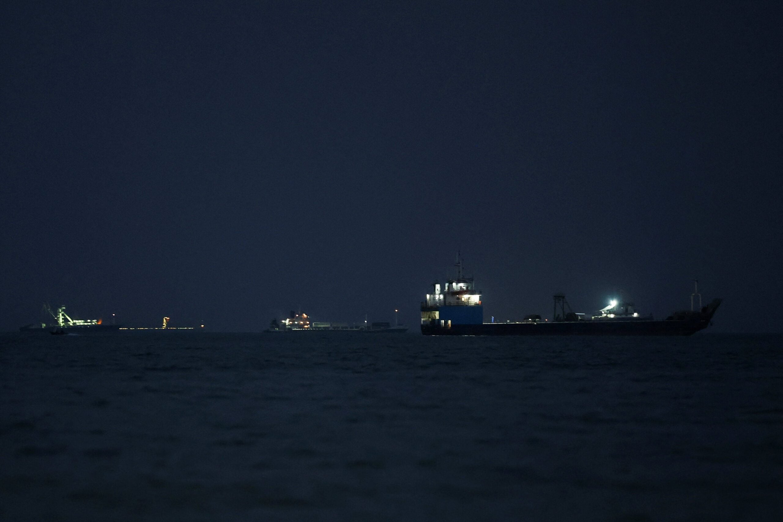 Vessels in the Strait of Hormuz are visible near the beach of Bandar Abbas