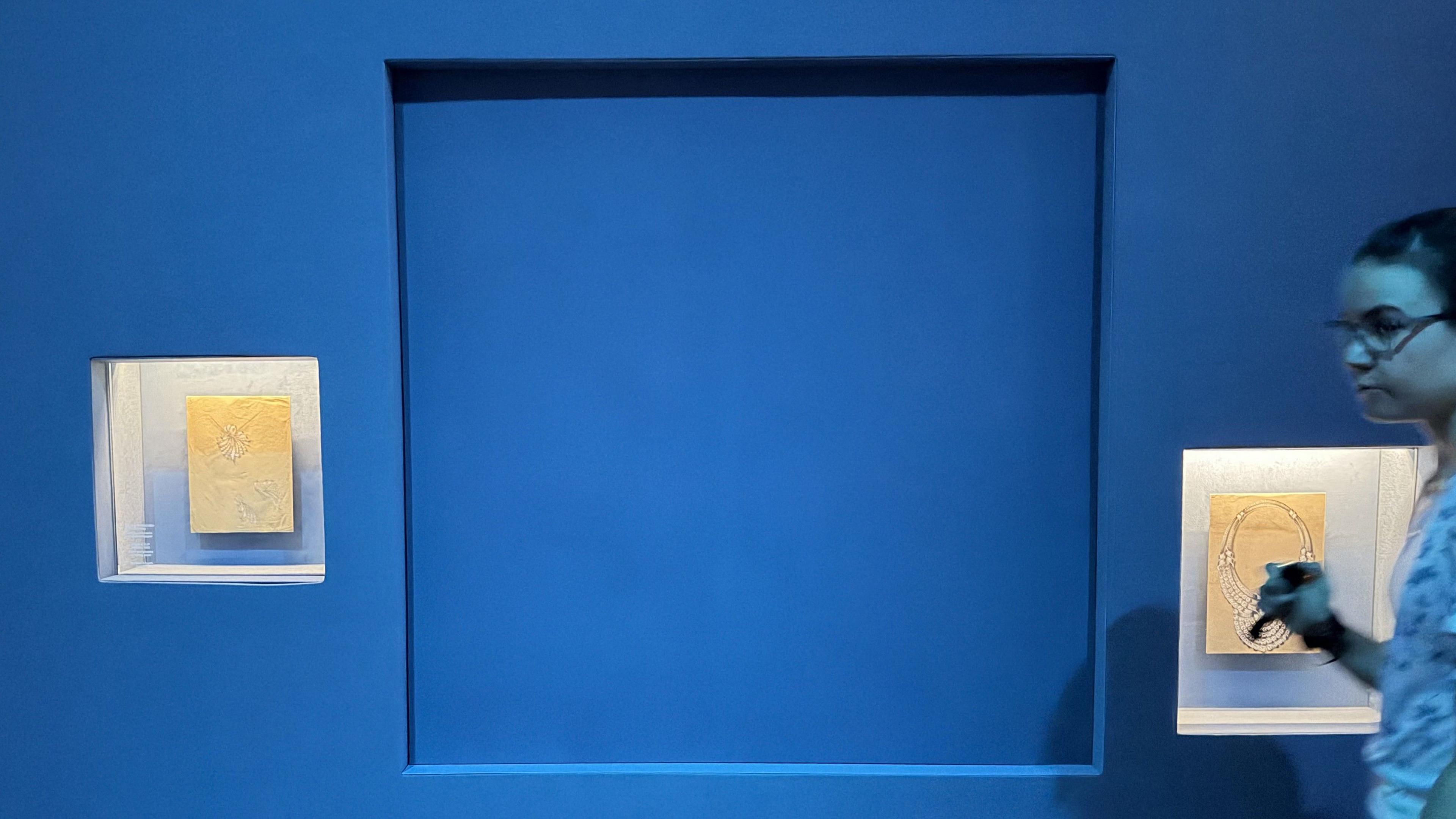 An empty blue display in an exhibition at the Vienna Museum of Applied Arts (MAK).