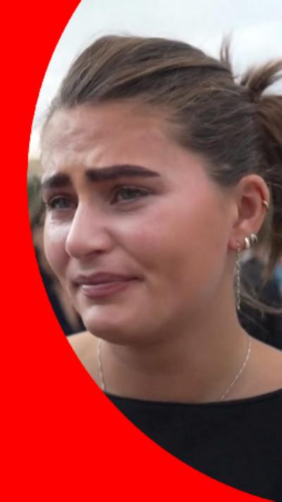A woman appears upset 