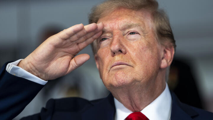 President Donald Trump stands during the National Anthem at the start of the NTT INDYCAR Series on August 23, 2026 in Washington, DC.