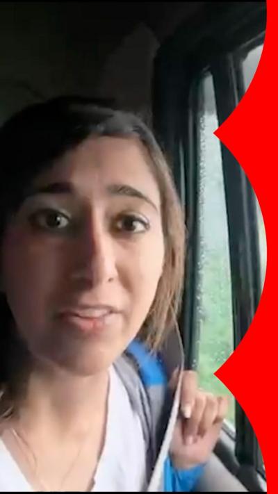 A woman talks to the camera