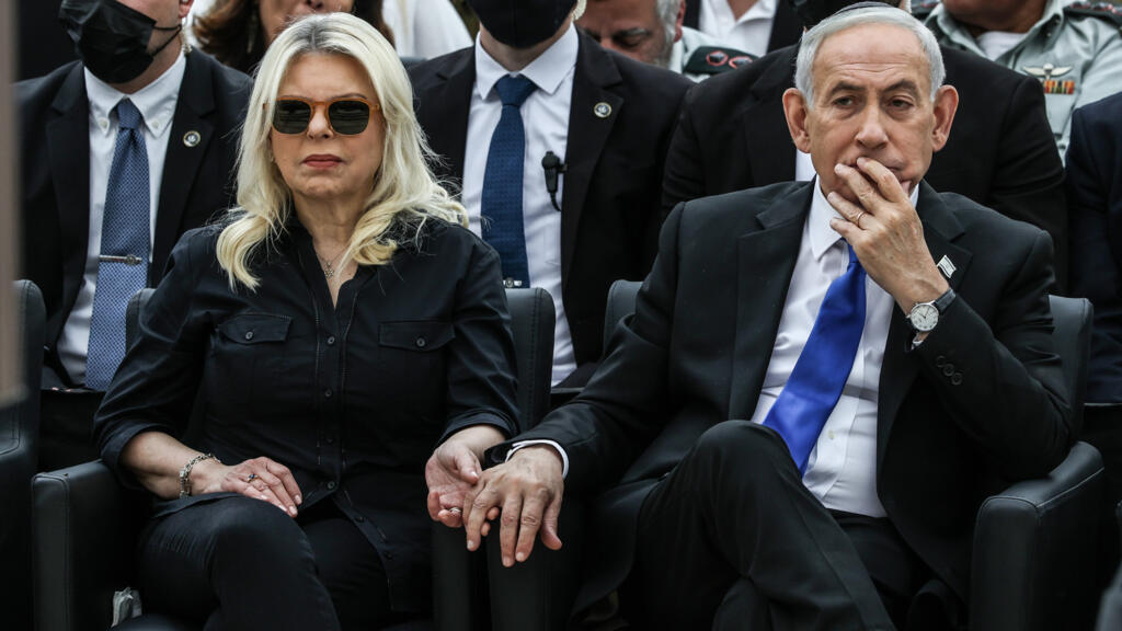 Israel's Prime Minister Benjamin Netanyahu, right, and his wife Sara attend a ceremony commemorating Israel's Remembrance Day for fallen soldiers, or Yom HaZikaron, at the Military Cemetery on Mount Herzl in Jerusalem, Tuesday April 21, 2026.