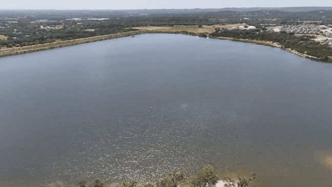 Image for gallery: Boerne water turns brown after flooding stirs debris in City Lake