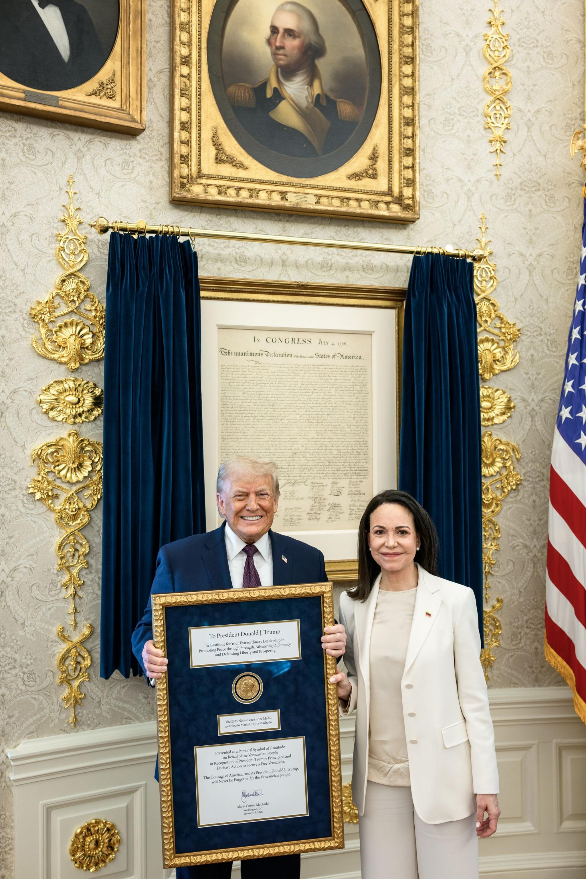 María Corina Machado and President Trump hold the Nobel in the White House