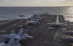 Thailand stop to give USS Abraham Lincoln crew first regular port visit in months A fighter jet takes off from an aircraft carrier deck.