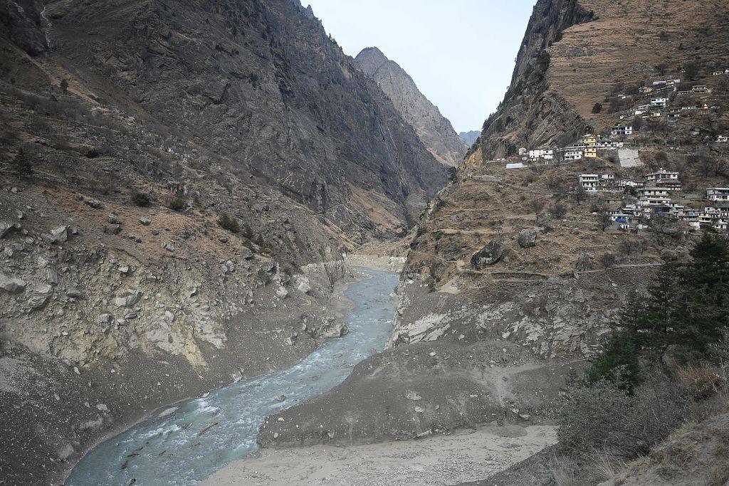 This general view shows the confluence of Dhauliganga River (L) and the Rishiganga River near Raini village, in Chamoli district on February 9, 2021 
