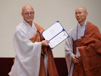 Largest Buddhist sect's leader wins reelection