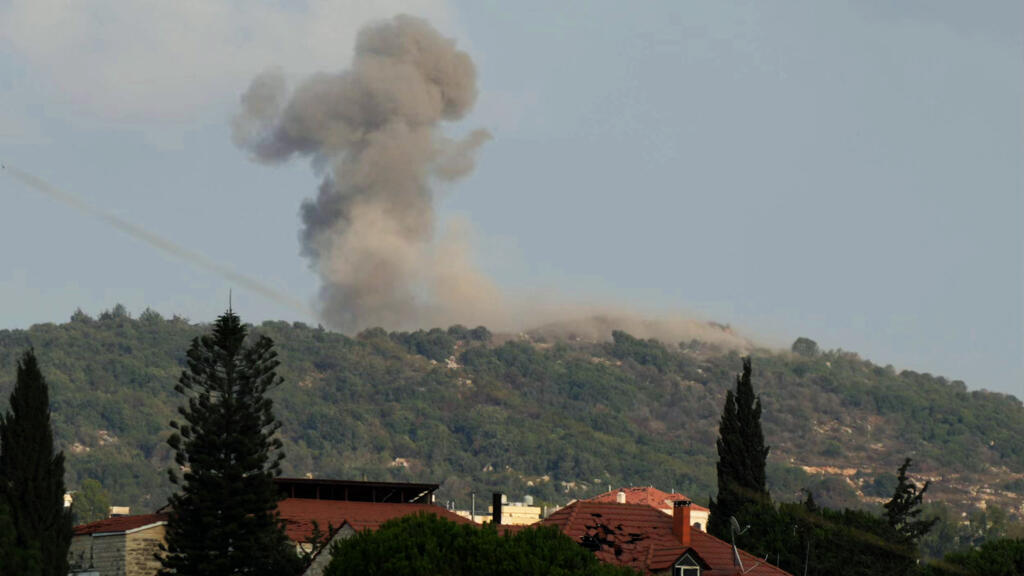 Smoke rises from the site of Israeli strikes that targeted the hilltops of the mountainous area of the strategic Ali al-Taher ridge