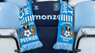 Bipin Patel's Coventry City shirt and his son Anant's scarf on his seat which is sky blue in colour, at the stadium