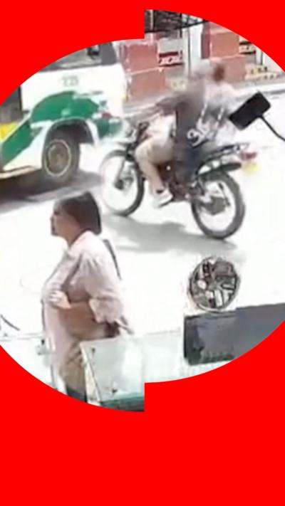 CCTV footage of a motorbike moments away from colliding with a bus in Colombia.