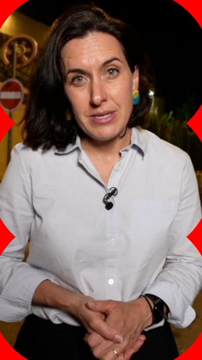 Katy Watson's piece to camera, wearing a grey shirt