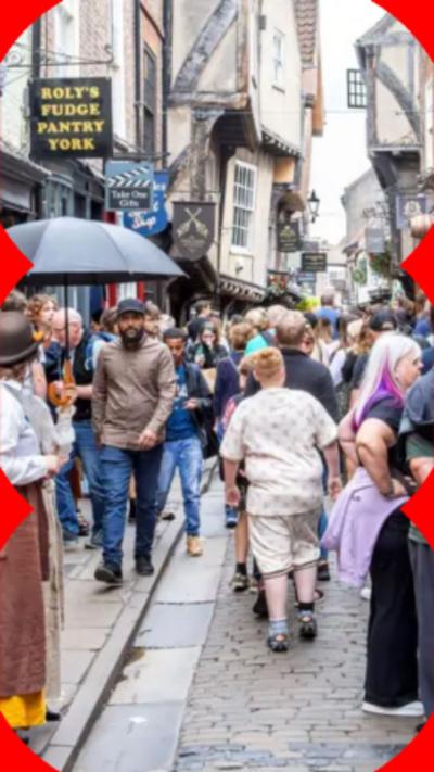 An image of an old street full of tourists in York.