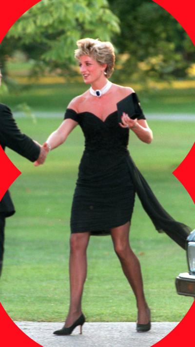 Princess Diana shakes a man's hand, she's wearing a black dress