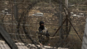 An Israeli soldier standing guard at the Israeli-controlled Golan Heights town of Majdal Shams, on July 17, 2025.