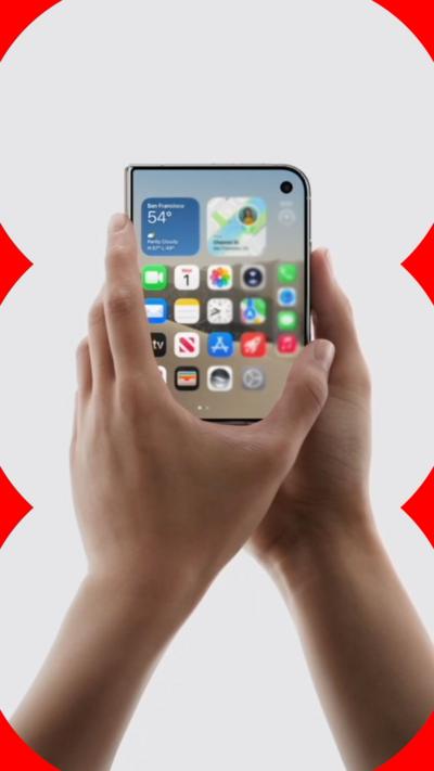 A pair of hands hold Apple's new iPhone Duo.