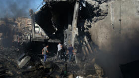 Palestinians inspect the rubble of a building destroyed in an Israeli airstrike in Gaza City, Monday, Aug. 24, 2026. 
