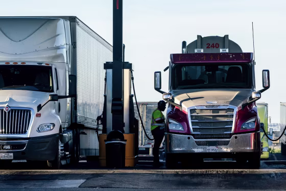 Drivers refuel trucks with diesel fuel at a Pilot gas station