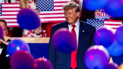 Donald Trump on stage as balloons fall at Republican Convention 