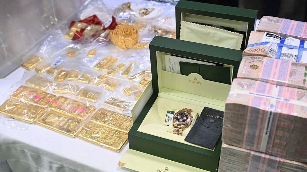 Seized assets, including gold, jewellery, watches and Thai Baht bank notes