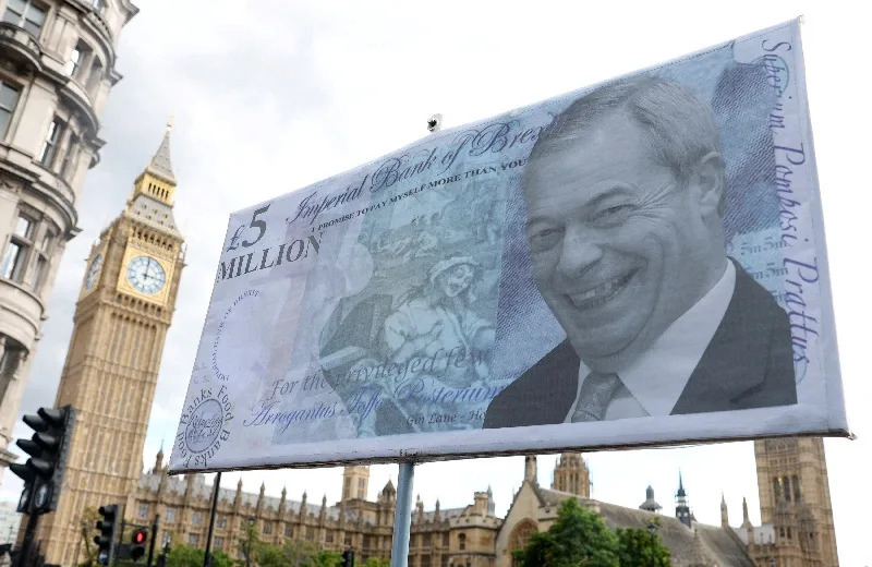Potest placard depicting leader of Reform UK party Nigel Farage displayed near the Houses of Parliament in London