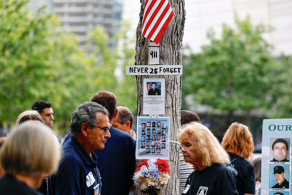 People gather at the National September 11 Memorial during the 25th anniversary commemoration of the September 11, 2001 attacks.