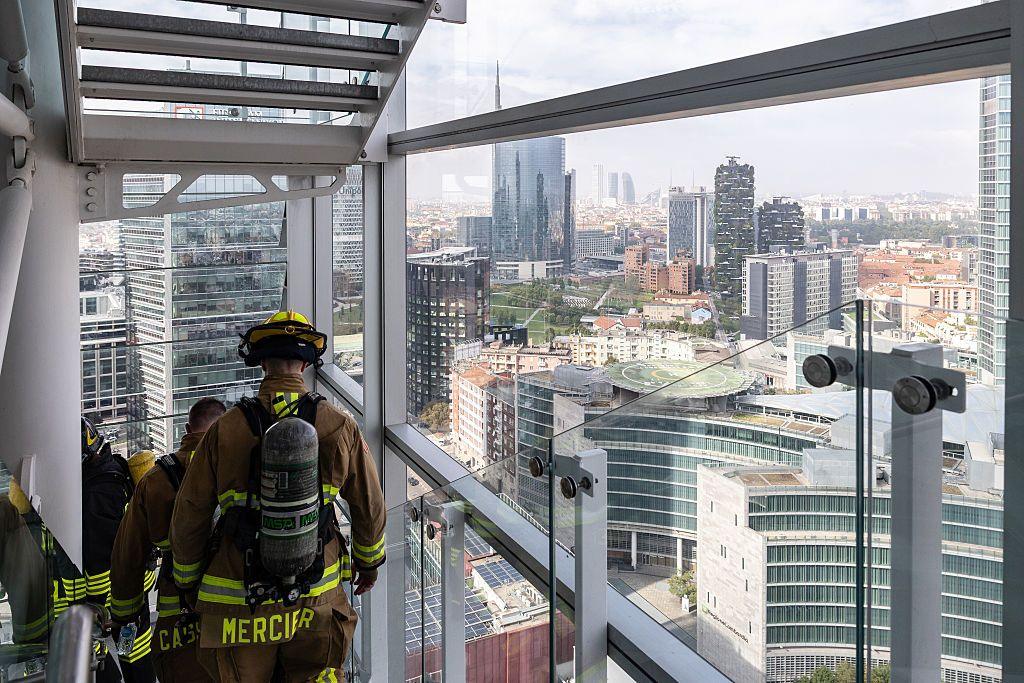 American firefighters walk down as they take part in a memorial stair climb on September 11, 2026 in Milan, Italy. The group of 70 Italian firefighters and seven American firefighters from the Aviano Air Base are climbing Milan's 33-story Torre Galfa in honor of the 343 members of the New York City Fire Department (FDNY) killed during the collapse of the World Trade Center towers on September 11, 2001. The firefighters are undertaking an up-and-down circuit of the stairwells four times, wearing 20-kilogram turnout gear, in memory of the FDNY firefighters who lost their lives responding to the 9/11 terror attacks.
