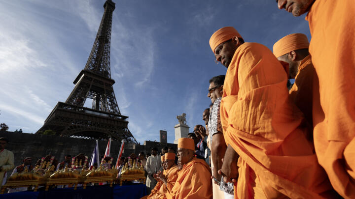 Bochasanwasi Akshar Purushottam Swaminarayan Sanstha (BAPS) Hindu monks take part in a religious ceremony in front of the Eiffel Tower in Paris on  September 3, 2026.