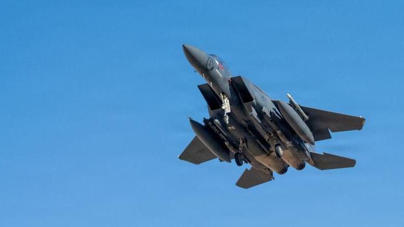 A US F-15E fighter jet flying in the sky