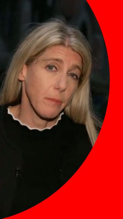Woman with blond hair in a black top