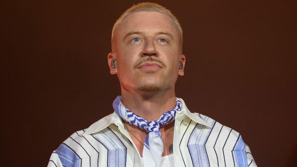 American rapper Macklemore performs live on stage during the 5th Lollapalooza Paris Festival on July 19, 2025 in Paris, France. 