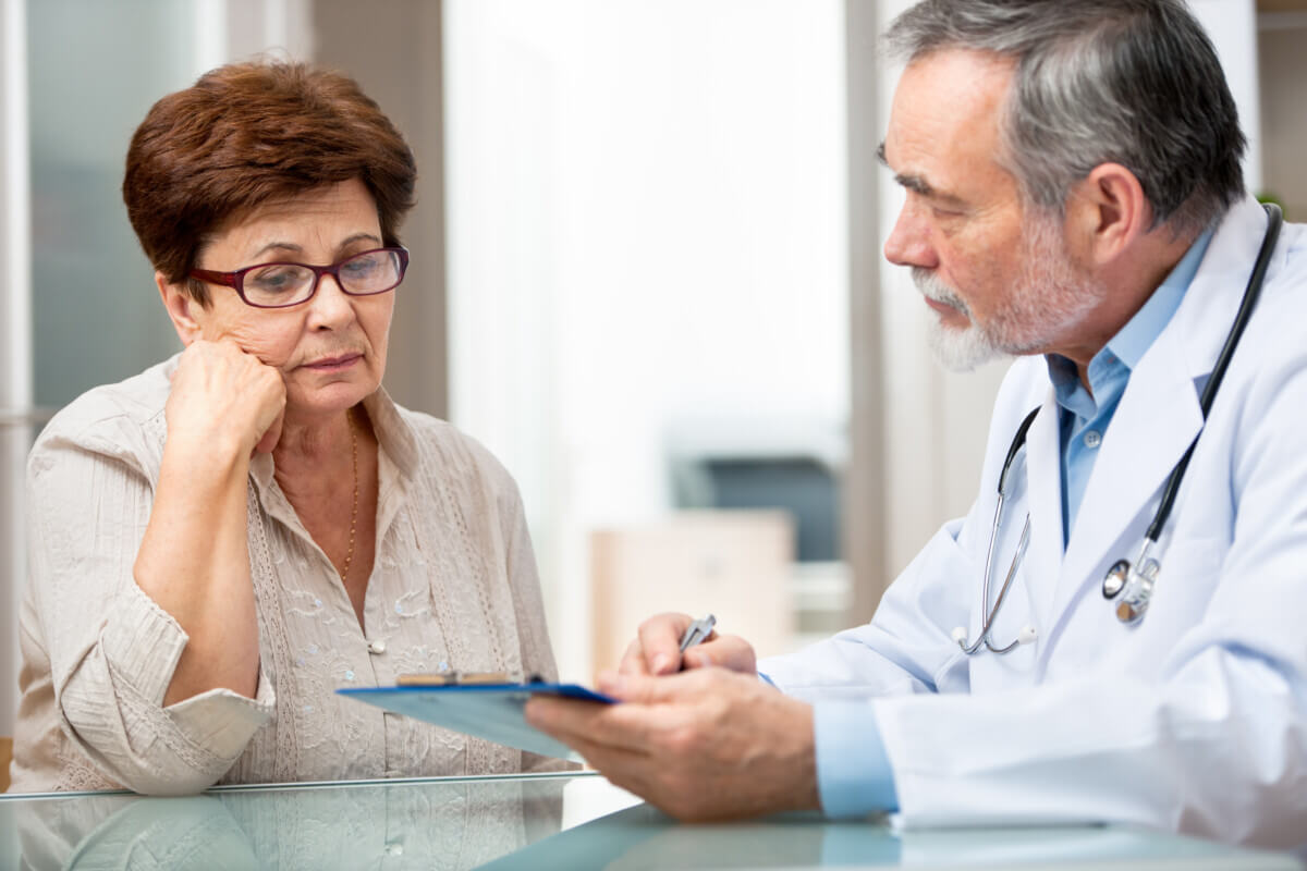 Senior woman talking with her doctor