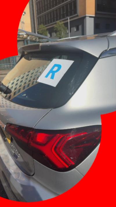 New blue R plate on grey car