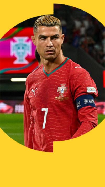 Cristiano Ronaldo staring into the distance. He is wearing a red Portugal top.