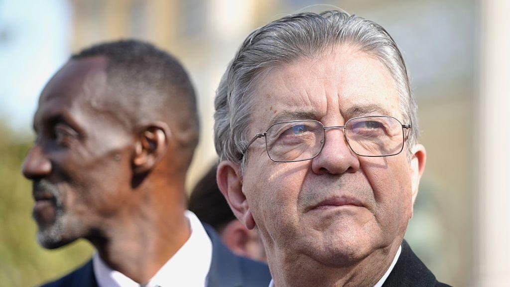 Jean-Luc Melenchon of the far -left France Unbowed party is seen with Bally Bagayoko (L) , mayor of Saint-Denis during a protest on September 29, 2026 in Paris, France. Members of France's public sector unions, including teachers, firefighters, healthcare workers and government staff, are striking on Tuesday to pressure the government ahead of its release of the proposed 2027 budget, which reportedly includes cuts and plans to freeze civil servants' base pay for a fourth consecutive year.